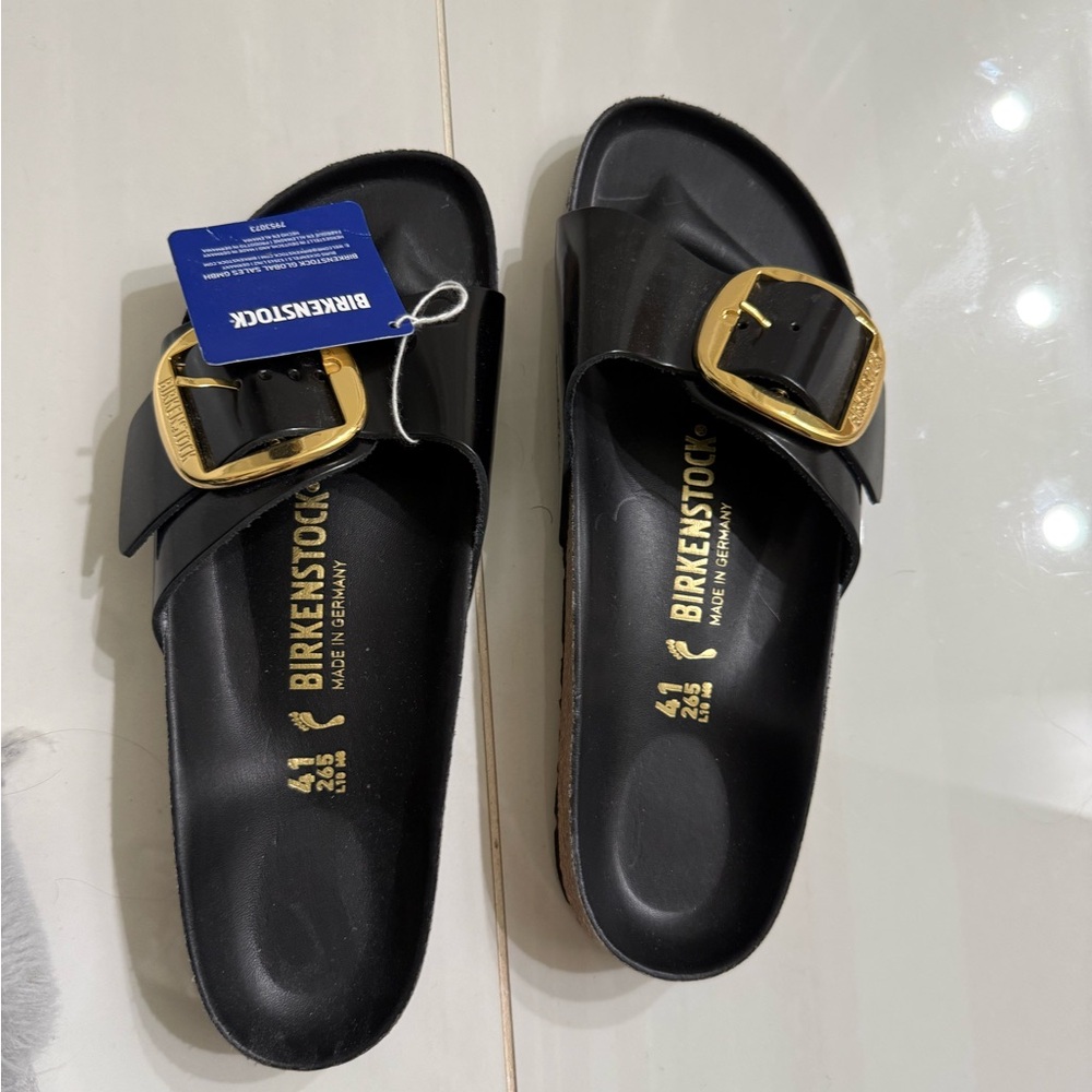 Birkenstock Black and Gold Sandals with Sleek Design